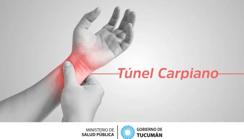 Mano con zona roja de dolor en la muñeca, indicando el síndrome del túnel carpiano.