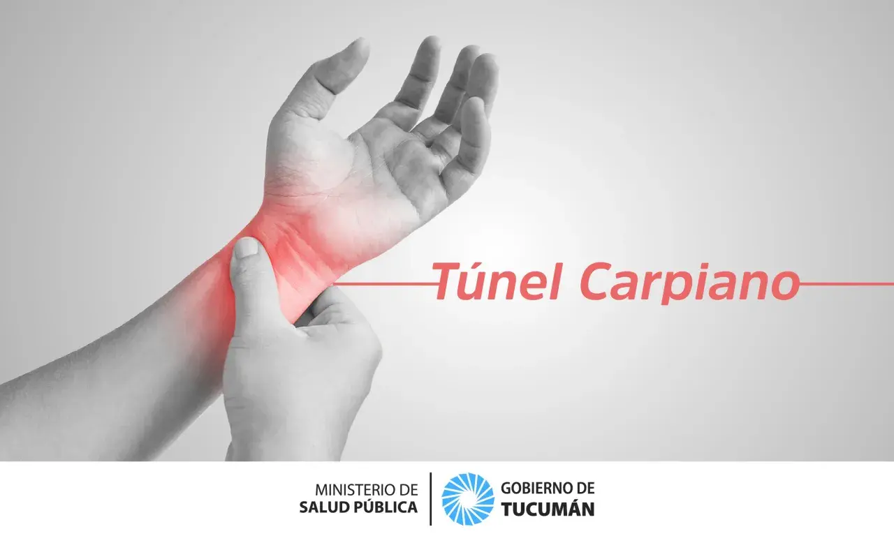 Mano con zona roja de dolor en la muñeca, indicando el síndrome del túnel carpiano.